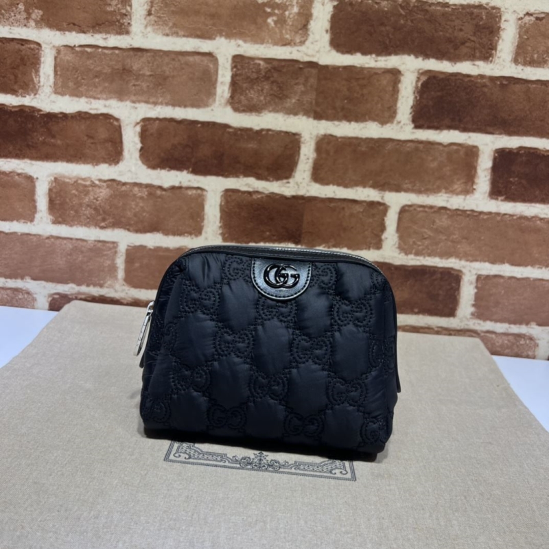 G*u*i clutch bags
